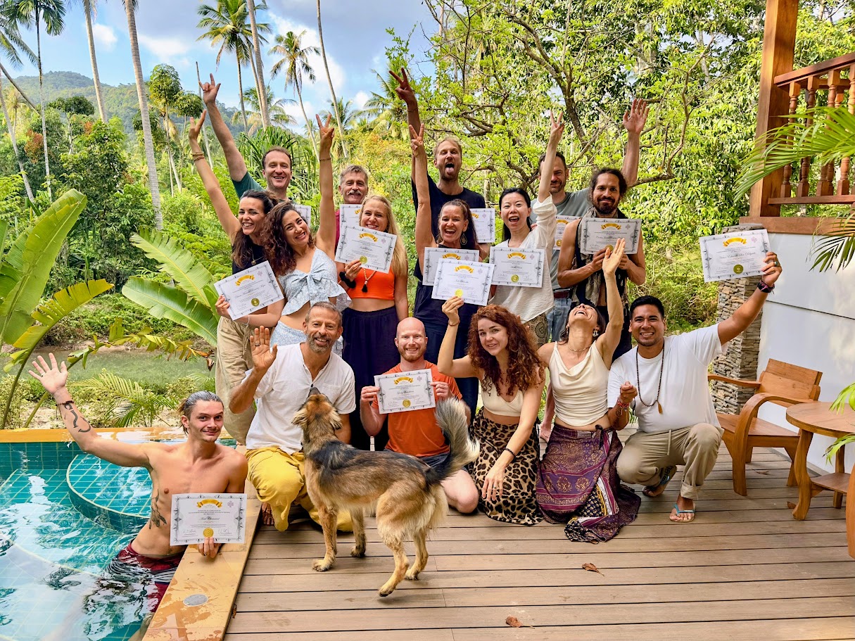 Group photo of Rebirthing Breathwork facilitator graduates holding certificates at the Yoga House in Ko Pha-ngan, Thailand